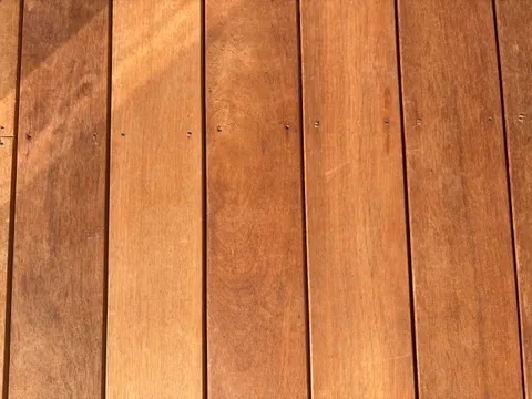 Overhead view of freshly laid merbau decking boards with countersunk screw fixings